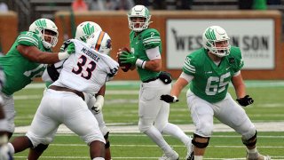 Austin Aune #2 of the North Texas Mean Green looks downfield for an open receiver against the UTSA Roadrunners at Apogee Stadium on Nov. 27, 2021 in Denton, Texas.