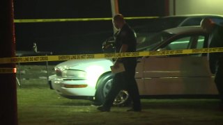 One person was killed and at least 14 others were injured Sunday night in a drive-by shooting during a candlelight vigil near Houston, a sheriff said.