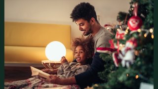 Father reading to child- Holidays