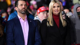 Senior advisor to the President Ivanka Trump (R) and brother Donald Trump Jr. listens during a rally in support of Republican incumbent senators Kelly Loeffler and David Perdue ahead of Senate runoff in Dalton, Georgia on January 4, 2021.