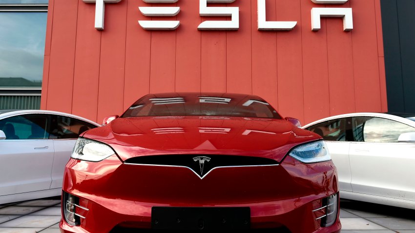 The logo marks the showroom and service center for the US automotive and energy company Tesla in Amsterdam on October 23, 2019.