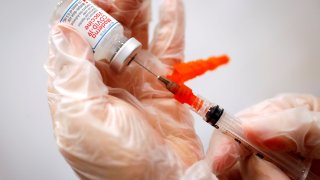 A healthcare worker prepares a syringe with the Moderna COVID-19 vaccine at a pop-up vaccination site operated by SOMOS Community Care during the COVID-19 pandemic in Manhattan in New York City, January 29, 2021.