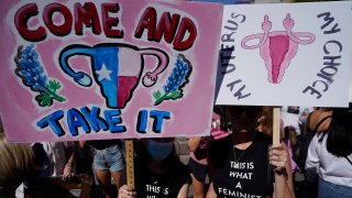 Demonstrators rally to to demand continued access to abortion during the March for Reproductive Justice