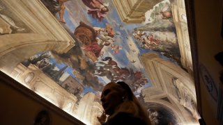 Princess Rita Boncompagni Ludovisi stands beneath a fresco by Italian Baroque painter Giovanni Francesco Barbieri, known as Guercino, inside The Casino dell'Aurora, also known as Villa Ludovisi, in Rome, Tuesday, Nov. 30, 2021.