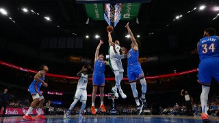 Dwight Powell #7 of the Dallas Mavericks drives to the basket during the game against the Oklahoma City Thunder on January 2, 2022 at Paycom Arena in Oklahoma City, Oklahoma.