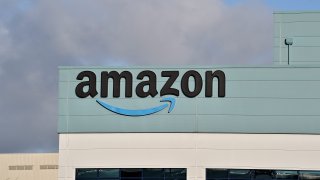 The Amazon logo is displayed outside the Amazon UK Services Ltd Warehouse on January 05, 2022 in Warrington, England.