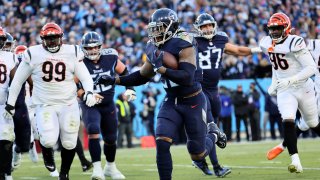 Running back Derrick Henry #22 of the Tennessee Titans rushes for a second quarter touchdown against the Cincinnati Bengals in the AFC Divisional Playoff game at Nissan Stadium on January 22, 2022 in Nashville, Tennessee.