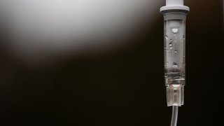 FILE - A monoclonal antibody treatment on an IV pole in the parking lot at Wayne Health Detroit Mack Health Center in Detroit, Michigan, Dec. 23, 2021.