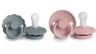 The Classic and Daisy designs of the FRIGG pacifier