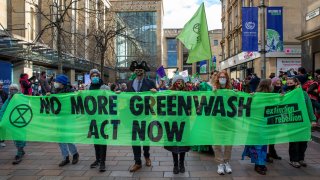 Extinction Rebellion and other climate change activist groups organized a greenwash march during COP26 to call on world leaders to act appropriately to the problem of combatting climate change and stop their current destructive habits. The rally was held on the 3rd of November 2021 outside Glasgow Royal Concert Hall, in Glasgow, United Kingdom.