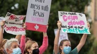 People take part in the Women's March ATX rally, Saturday, Oct., 2, 2021 in at the Texas State Capitol in Austin, Texas. The march was a response to controversial legislation recently passed by Texas lawmakers which has banned most abortions in Texas.