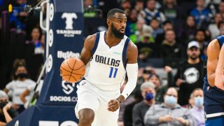 Dallas Mavericks guard Tim Hardaway Jr. brings the ball down court against the Minnesota Timberwolves during the second half of an NBA basketball game Sunday, Dec. 19, 2021, in Minneapolis.