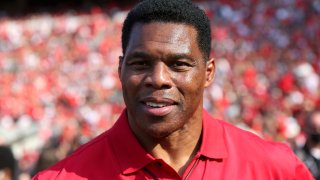Former running back Herschel Walker for the Georgia Bulldogs on the sidelines against the UAB Blazers in the first half at Sanford Stadium on September 11, 2021, in Athens, Georgia.