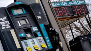 Signs display gas prices in Washington, DC, on Feb. 23, 2022