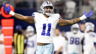 Micah Parsons #11 of the Dallas Cowboys celebrates after a sack during the second half against the Washington Football Team at AT&T Stadium on December 26, 2021 in Arlington, Texas.