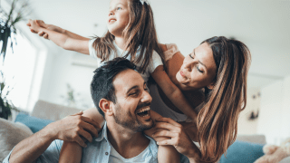 Happy parents with daughter