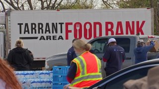 Cars lined up outside the Herman Clark Stadium in Fort Worth on Wednesday for a mega mobile food distribution.