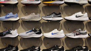 Shoes line the shelves at the Nike store on December 21, 2021 in Miami Beach, Florida.