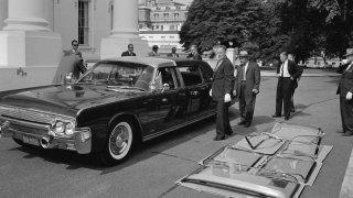 The plastic-topped limousine for President John F. Kennedy sits outside the White House, June 14, 1961, in Washington, D.C. The O’Gara Hess Eisenhardt Armoring Company filed a notice on March 10, 2022, that it will lay off all of its employees in Fairfield, Ohio, and close permanently.