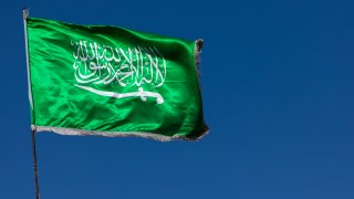 Saudi arabian flag in the wind against clear sky, Al Madinah Province, Yanbu, Saudi Arabia