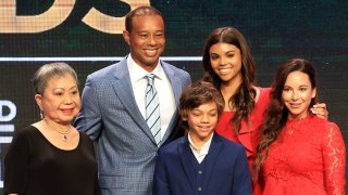 Tiger Woods, mother Kultida Woods (L), children Sam Alexis Woods and Charlie Axel Woods (C) and Erica Herman (R) pose for a photo prior to his induction at the 2022 World Golf Hall of Fame Induction at the PGA TOUR Global Home.