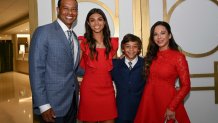 Woods poses with his daughter, Sam, son, Charlie, and girlfriend Erica Herman after the World Golf Hall of Fame Induction Ceremony.