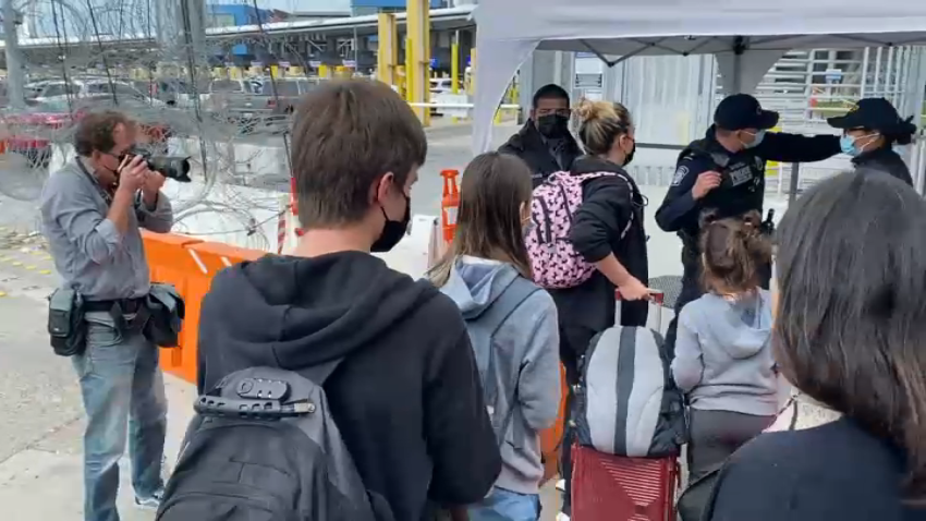 A Ukrainian mother asks for asylum in the U.S. at the border in Tijuana, Mexico, on March 10, 2022.