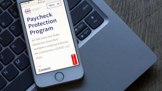 Portland, OR, USA – July 22, 2020: The U.S. Small Business Administration website’s Paycheck Protection Program (PPP) page is seen on a phone. PPP loan helps businesses keep their workforce employed.