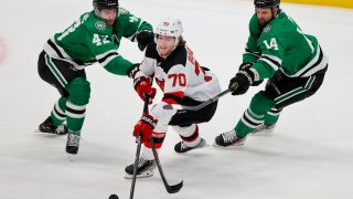 Dallas Stars left wing Marian Studenic (43) and left wing Jamie Benn (14) defend against New Jersey Devils center Jesper Boqvist (70) during the second period of an NHL hockey game in Dallas, Saturday, April 9, 2022.