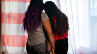 Jacqueline Flores, left, holds hands with her daughter Nicky at their home in Virginia, Wednesday, July 14, 2021.