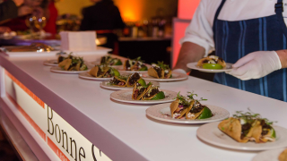 man serving food at Bonne Sante