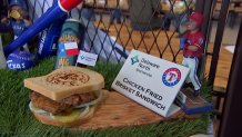 Chicken Fried Brisket Sandwich: Generous pieces of in-house-smoked Nolan Ryan Beef Brisket - hand-battered and fried - piled on thick slices of Texas Toast with pickles, red onions and Sweet Baby Ray's barbecue sauce. Available at the Sweet Baby Ray's stand at Section 125.