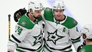 Dallas Stars center Jamie Benn (14) and defenseman Miro Heiskanen (4) on the ice after Benn scored the game winning goal in overtime of an NHL hockey game against the Anaheim Ducks played on March 31, 2022 at the Honda Center in Anaheim, CA.