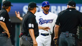ARLINGTON, TX – APRIL 11: Manager Chris Woodward of the Texas Rangers argues a slide interference call that ended the game in the 10th inning against the Colorado Rockies in the home opener at Globe Life Field April 11, 2022 in Arlington, Texas. Colorado won 6-4. (Photo by Brandon Wade/Getty Images)