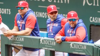 ARLINGTON, TX – APRIL 17: Texas Rangers manager Chris Woodward (8) looks on during the game between the Texas Rangers and the Los Angeles Angels on April 17, 2022 at Globe Life Field in Arlington, Texas.