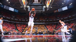 Reggie Bullock #25 of the Dallas Mavericks grabs the rebound against the Utah Jazz during Round 1 Game 3 of the NBA Playoffs on April 21, 2022 at vivint.SmartHome Arena in Salt Lake City, Utah.