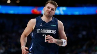 Luka Doncic #77 of the Dallas Mavericks reacts after scoring a basket in the first half against the Portland Trail Blazers at American Airlines Center on April 8, 2022 in Dallas, Texas.