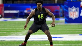 Tyler Smith #OL48 of the Tulsa Hurricane runs a drill during the NFL Combine at Lucas Oil Stadium on March 04, 2022 in Indianapolis, Indiana.