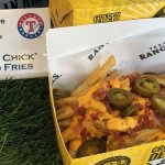 Golden Chick's signature battered fries loaded with Ricos Nacho Cheese, bacon bits and Ricos Jalapenos. Available at the Golden Chick stand at Section 128.