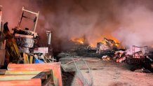 Lightning is suspected to have ignited a fire at a wooden pallet storage facility in Alvarado Monday night.