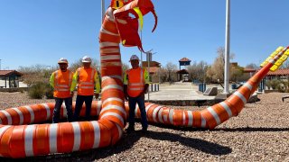 Hundreds of construction barrels recently went up in El Paso, but not for the reason you may be thinking. TxDOT workers recently used the barrels to build a giant snake sculpture.