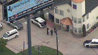 Police in Hutchins, Texas, and deputies with the Dallas County Sheriff’s Department investigate a robbery, April 21, 2022.