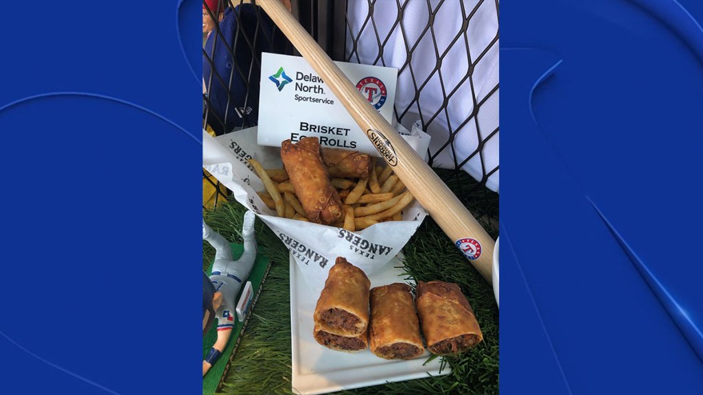 Brisket Egg Rolls: Created by a Rangers fan in 2020 as part of a recipe contest. Tender house-smoked brisket shredded and rolled up in a classic eggroll wrap with Napa cabbage - deep fried until crispy and delicious. Served with Togarashi-seasoned fries and Sweet Baby Ray's barbecue sauce for dipping. Available at the Go Deep Fried stands at Sections 121, 225 and 230.