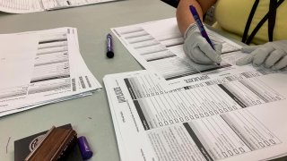 Workers check ballots at elections offices in Clackamas County, Oregon, the state’s third most populous county south of Portland, May 17, 2022.