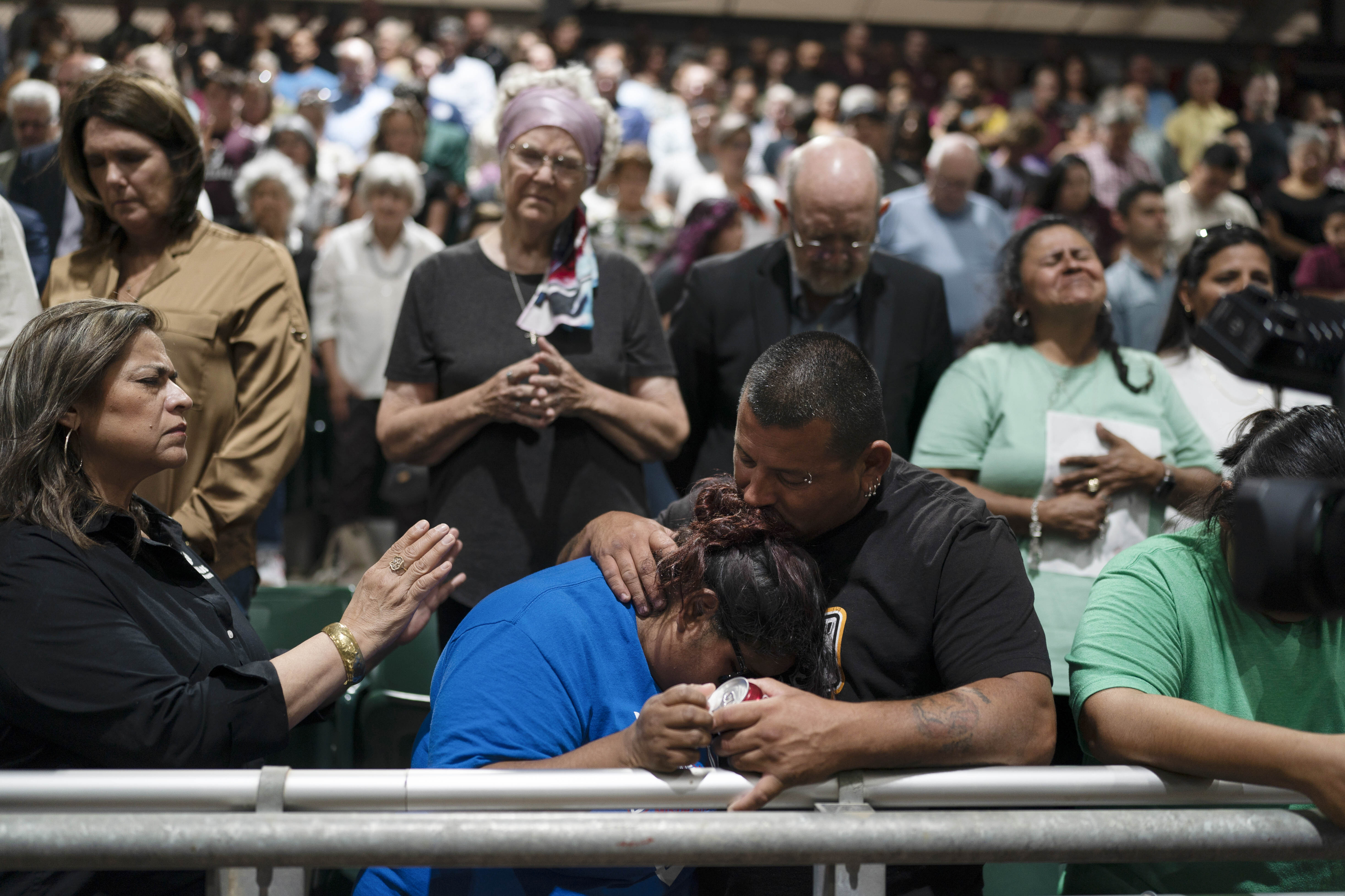 Two family members of one of the victims killed in Tuesday’s shooting at Robb Elementary School comfort each other during a prayer vigil in Uvalde, Texas, Wednesday, May 25, 2022.