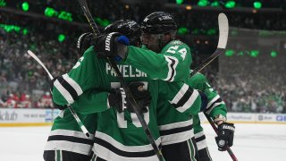 DALLAS, TX – MAY 7: Joe Pavelski #16 and Vladislav Namestnikov #92, Roope Hintz #24 and the Dallas Stars celebrate a goal against the Calgary Flames in Game Three of the First Round of the 2022 Stanley Cup Playoffs at the American Airlines Center on May 7, 2022 in Dallas, Texas. (Photo by Glenn James/NHLI via Getty Images)