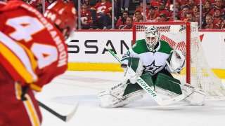 CALGARY, AB – MAY 15: Erik Gudbranson #44 of the Calgary Flames takes a shot on Jake Oettinger #29 of the Dallas Stars during the first period of Game Seven of the First Round of the 2022 Stanley Cup Playoffs at Scotiabank Saddledome on May 15, 2022 in Calgary, Alberta, Canada.