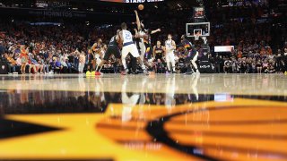 Deandre Ayton #22 of the Phoenix Suns and Dwight Powell #7 of the Dallas Mavericks go up for the opening tip during the first half of Game Two of the Western Conference Second Round NBA Playoffs at Footprint Center on May 04, 2022 in Phoenix, Arizona.