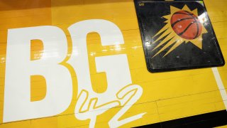 A decal honoring WNBA player Brittney Griner is displayed on the court before Game Five of the Western Conference Second Round NBA Playoffs between the Phoenix Suns and the Dallas Mavericks at Footprint Center on May 10, 2022 in Phoenix, Arizona.