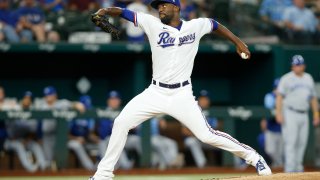 Taylor Hearn #52 of the Texas Rangers pitches against the Kansas City Royals in the fourth inning at Globe Life Field on May 12, 2022 in Arlington, Texas.